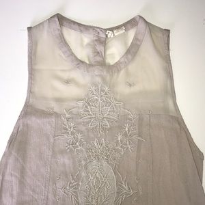 Tan beaded sleeveless shirt ( flower design )